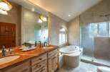 Indulge in luxury in this stunning master bathroom, featuring a spacious dual vanity with a beautiful marble countertop and elegant fixtures.