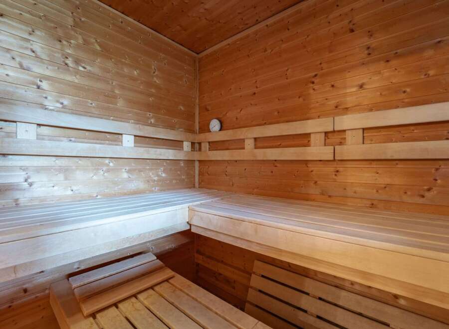 Experience ultimate relaxation in this beautifully crafted wooden sauna.