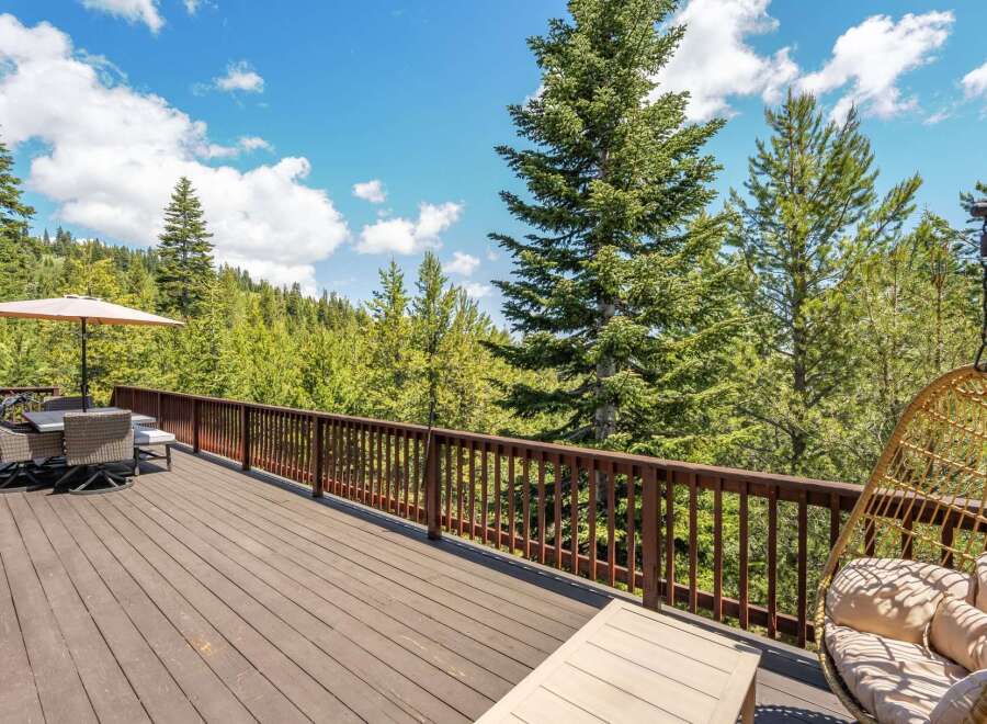 Enjoy breathtaking mountain views from this expansive deck, perfect for outdoor entertaining or quiet relaxation.