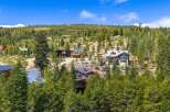 Nestled amidst a lush pine forest, this stunning mountain property offers a serene escape with multiple modern homes.