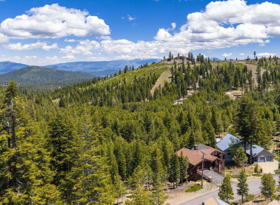 Nestled amidst a lush pine forest, this property offers breathtaking mountain views and a serene escape.