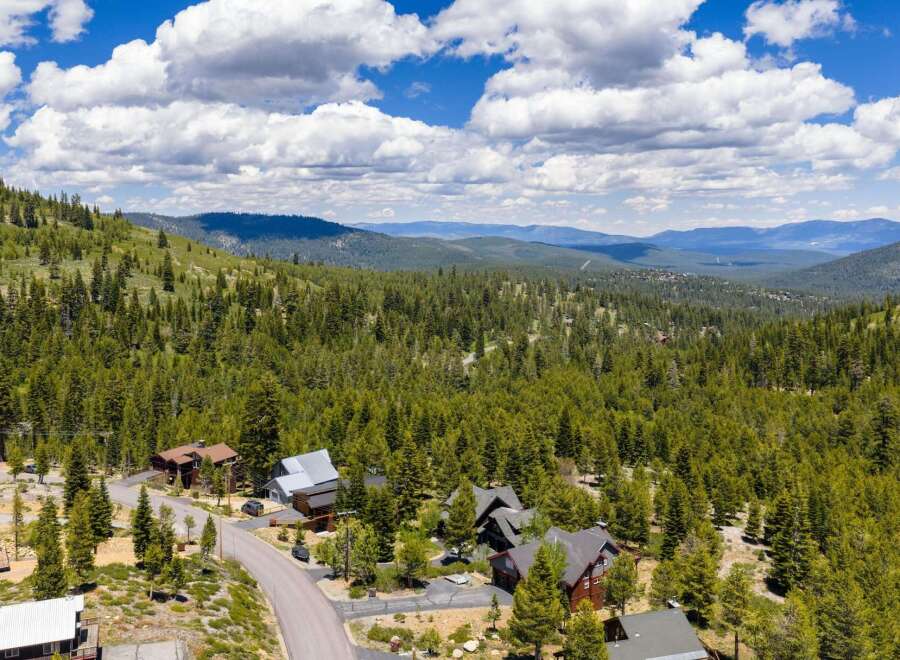 Nestled amidst a lush pine forest, this property offers a serene mountain retreat with stunning panoramic views.