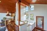 Experience rustic charm in this stunning home featuring a gourmet kitchen with custom wood cabinetry and a granite-topped island, perfect for entertaining.