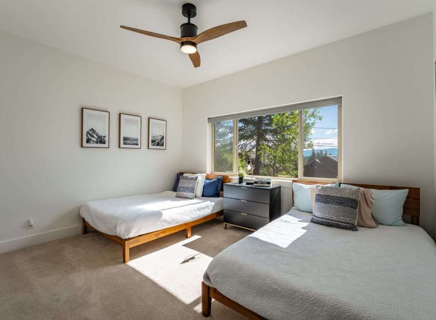 This bright and airy bedroom features two comfortable twin beds, perfect for accommodating guests or family.