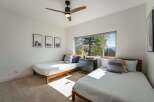 This bright and airy bedroom features two comfortable twin beds, perfect for accommodating guests or family.