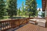 Enjoy the serene mountain views from this spacious wooden deck, perfect for outdoor entertaining or quiet relaxation.