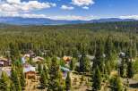 Nestled amidst a dense forest of evergreen trees, this charming mountain community offers a serene escape.