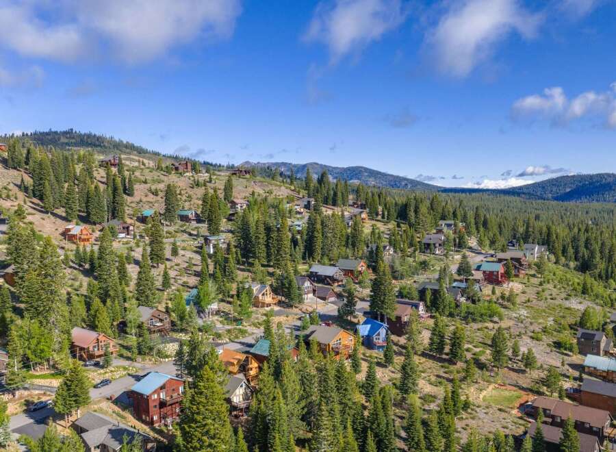 Discover this stunning mountain retreat nestled amidst towering pine trees and rolling hills.