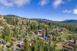 Discover this stunning mountain retreat nestled amidst towering pine trees and rolling hills.