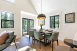 Experience modern mountain living in this stunning dining area, featuring a sleek dining set perfect for intimate gatherings.