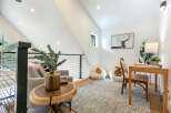 Discover this charming loft space, perfect for a home office or cozy reading nook.