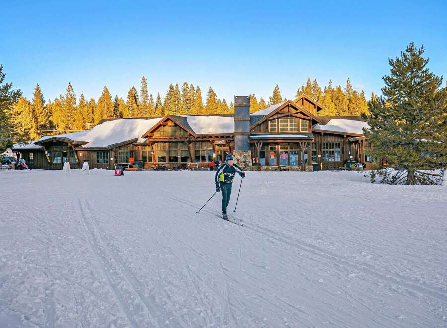 Experience the ultimate winter wonderland with this stunning property, perfectly situated amidst a serene forest landscape.