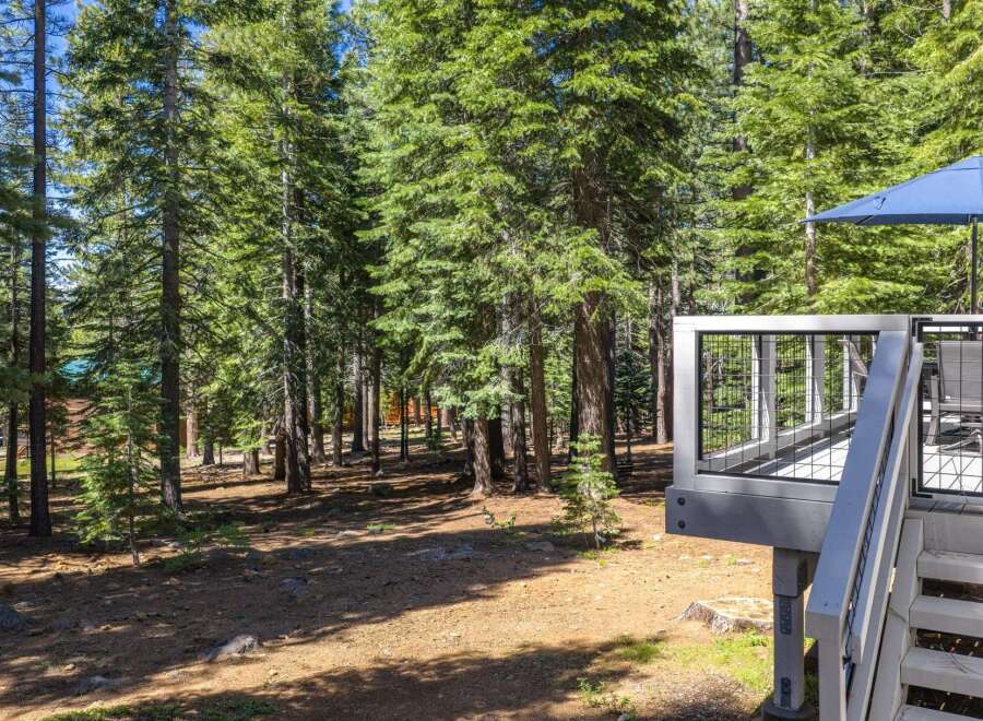Enjoy the serene mountain lifestyle with this charming property nestled amongst towering pine trees.