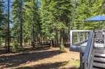 Enjoy the serene mountain lifestyle with this charming property nestled amongst towering pine trees.