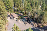Discover this unique property nestled among towering pine trees, offering a serene and private setting.