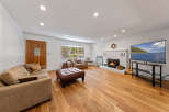 Step into this inviting living room, featuring a cozy fireplace and a large television perfect for entertainment.