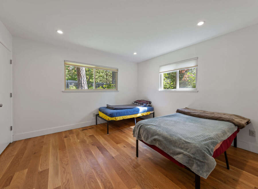 This bright bedroom features two twin beds, perfect for accommodating guests or family.