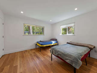 This bright bedroom features two twin beds, perfect for accommodating guests or family.