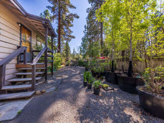 Discover this charming property featuring a welcoming porch and steps leading to the entrance.
