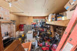 Discover ample storage and workspace in this versatile garage, perfect for your tools and equipment.