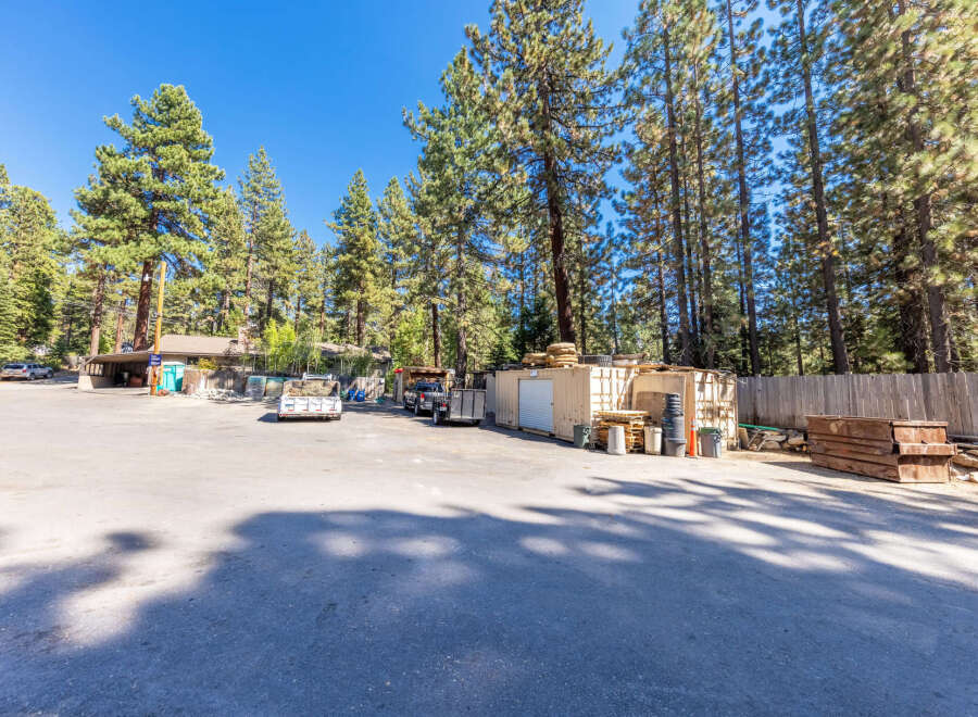 Discover this versatile commercial property featuring ample outdoor storage space, ideal for businesses requiring equipment and material staging.
