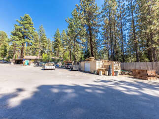 Discover this versatile commercial property featuring ample outdoor storage space, ideal for businesses requiring equipment and material staging.