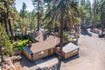 Discover this charming property nestled amongst mature pine trees, offering a serene and private setting.