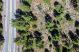 Discover this prime real estate opportunity featuring a paved road with clear yellow lane markings, ideal for easy access.