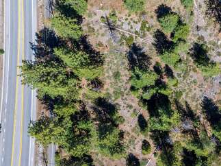 Discover this prime real estate opportunity featuring a paved road with clear yellow lane markings, ideal for easy access.