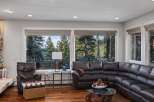 Experience breathtaking views from this stunning living room, featuring a spacious sectional sofa perfect for relaxation.