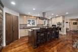 Experience luxury in this stunning kitchen, featuring a large island with bar seating perfect for entertaining.