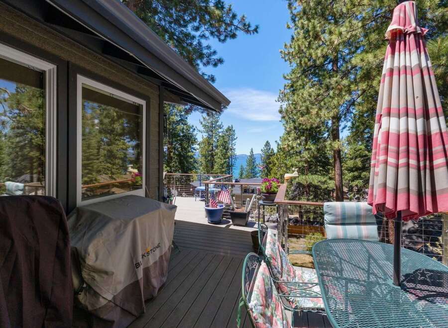 Enjoy breathtaking lake views from this stunning deck, perfect for entertaining or relaxing.
