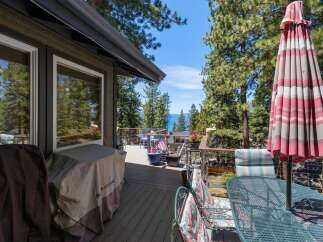 Enjoy breathtaking lake views from this stunning deck, perfect for entertaining or relaxing.