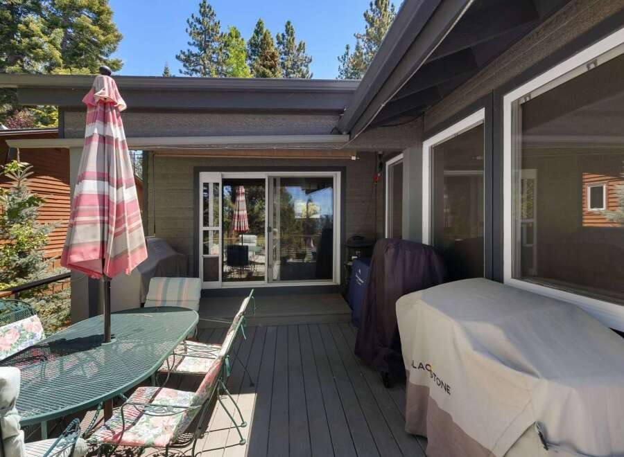 Enjoy outdoor living on this spacious deck, perfect for entertaining or relaxing.