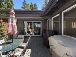 Enjoy outdoor living on this spacious deck, perfect for entertaining or relaxing.