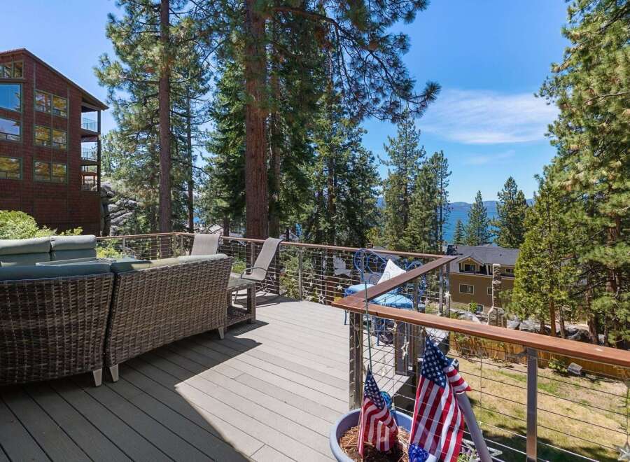 Enjoy breathtaking lake views from this expansive deck, perfect for entertaining or relaxing.