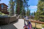 Enjoy breathtaking lake views from this expansive deck, perfect for entertaining or relaxing.