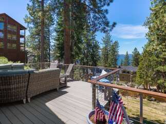 Enjoy breathtaking lake views from this expansive deck, perfect for entertaining or relaxing.