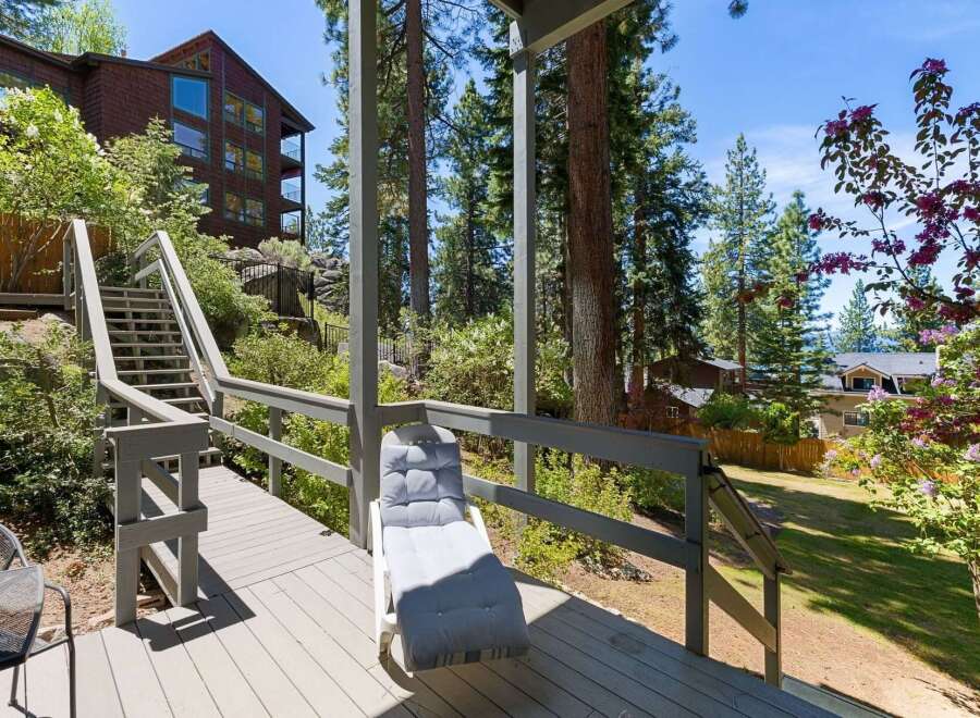 Enjoy the serene mountain setting from this spacious deck, perfect for outdoor relaxation.