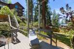 Enjoy the serene mountain setting from this spacious deck, perfect for outdoor relaxation.