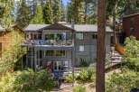 Experience luxury living in this stunning multi-level home, nestled amidst towering pine trees.