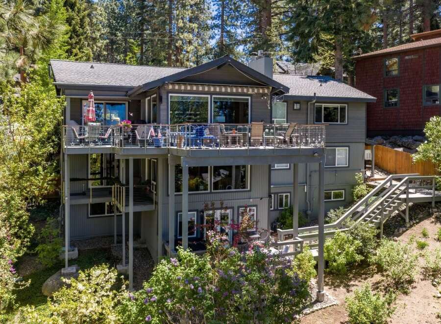 Experience luxury living in this stunning multi-level home, featuring expansive decks perfect for entertaining or enjoying the serene surroundings.