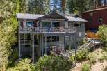 Experience luxury living in this stunning multi-level home, featuring expansive decks perfect for entertaining or enjoying the serene surroundings.