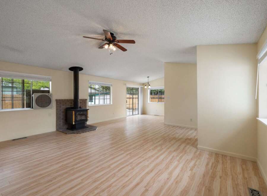 Discover this charming home featuring a cozy wood-burning stove, perfect for chilly evenings.