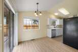 Discover a bright and airy dining area with a sliding glass door leading to the outdoors.