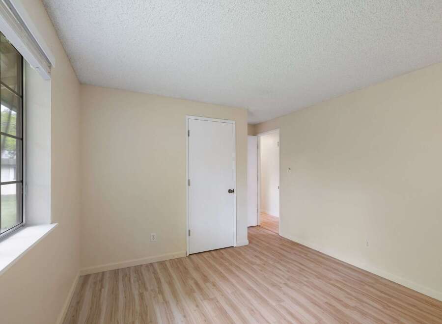 Discover this charming room featuring a large window that floods the space with natural light.