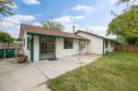 Enjoy outdoor living in this charming home featuring a spacious concrete patio perfect for entertaining.