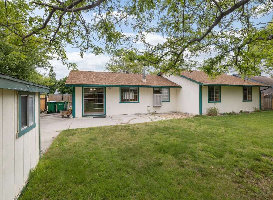 Discover this charming home with a spacious backyard, perfect for outdoor entertaining and relaxation.
