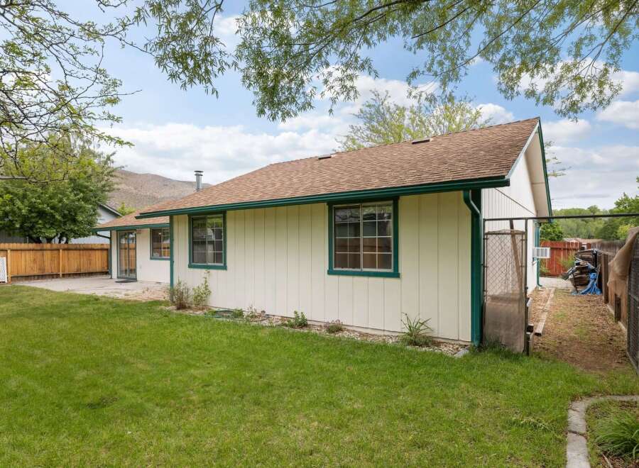 Discover this charming home with a spacious backyard, perfect for outdoor enjoyment and relaxation.