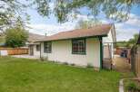 Discover this charming home with a spacious backyard, perfect for outdoor enjoyment and relaxation.